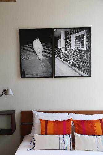 Ένα ή περισσότερα κρεβάτια σε δωμάτιο στο El Patio 77 B&B