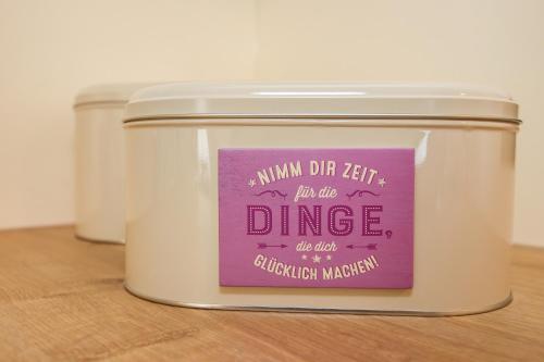 a jar of a candle with a label on it at Chalet Grossglockner in Fusch an der Glocknerstraße