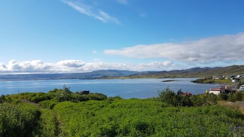 a view of a lake with mountains in the background at Kriukot in Hólmavík