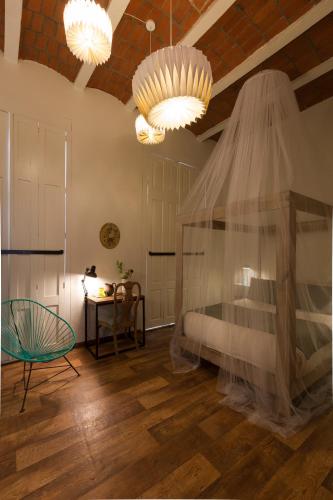 Ένα ή περισσότερα κρεβάτια σε δωμάτιο στο El Patio 77 B&B