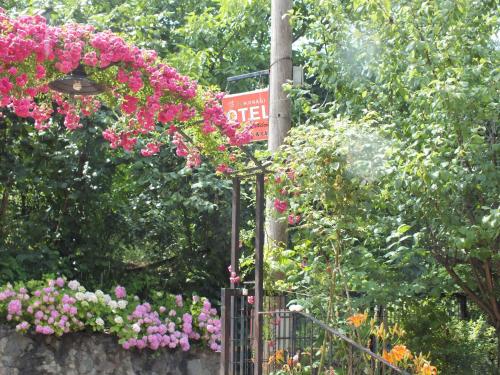 a bunch of flowers on a fence with a light at Sapanca Dilek Konagi Hotel in Sapanca