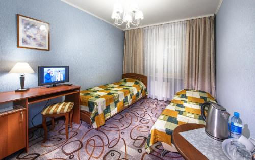 Katil atau katil-katil dalam bilik di Globus Hotel