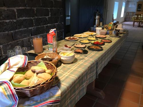 a long table with sandwiches and other foods on it at Bjärkas Golf & Country Club in Nivelax