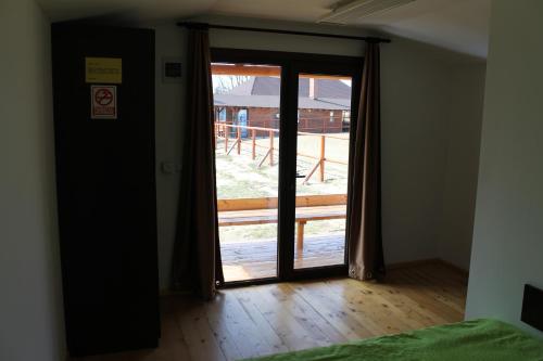 a room with a door open to a yard at Complex HAMAK in Iaşi
