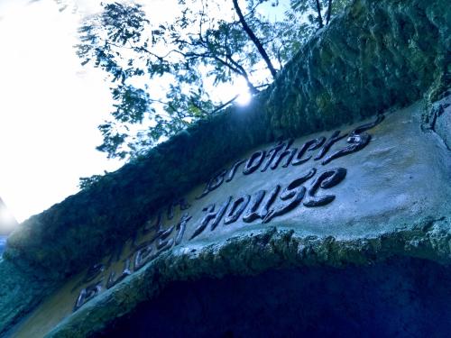 a sign that says happy music on the side of a road at Singh Brothers in Adams Peak