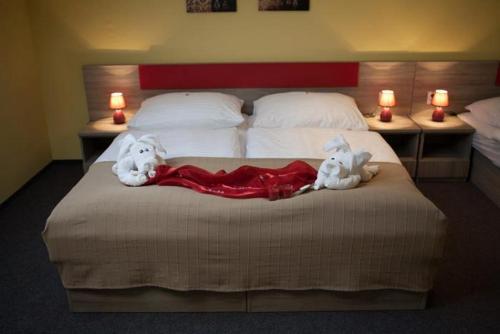 Posteľ alebo postele v izbe v ubytovaní F - Team Hotel