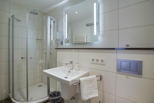Koupelna v ubytování Hotel Maxim