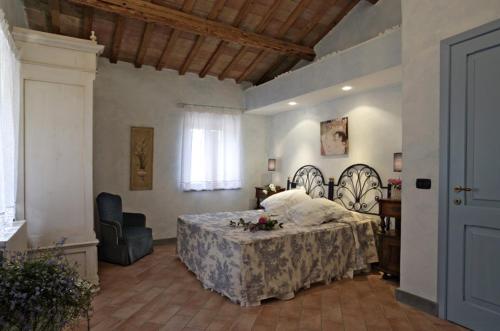 Ein Bett oder Betten in einem Zimmer der Unterkunft Poggio Montali