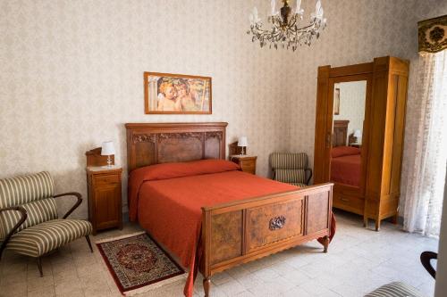 Posteľ alebo postele v izbe v ubytovaní Casa Nonna Rosa