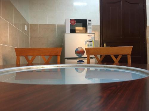 Η κουζίνα ή μικρή κουζίνα στο Kasr Dama Furnished Apartments