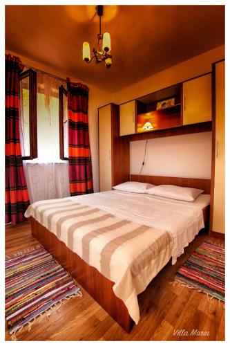 a bedroom with a bed and a window at Villa Marin in Pag