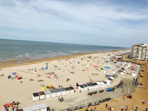 a beach with a lot of people and the ocean at Apartment S7 in Ostend
