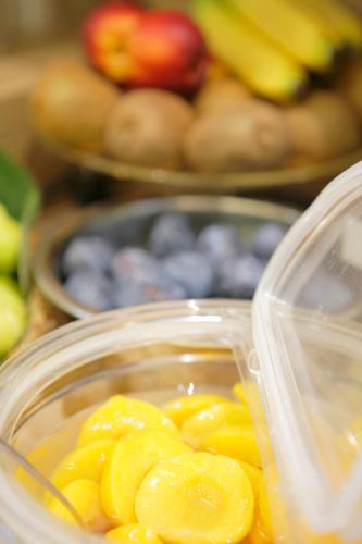 a plastic container filled with fruit on a table at Hotel Porta Nuova in Assisi