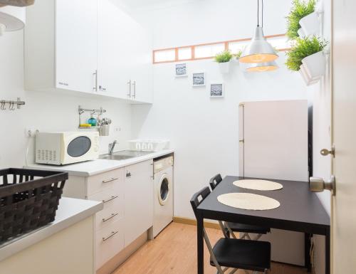 Kuchyň nebo kuchyňský kout v ubytování Marques Mini Hostel