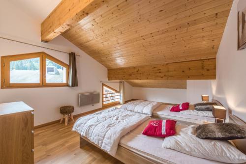 Postel nebo postele na pokoji v ubytování L'Eden Ski aux Pieds