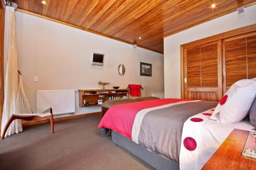 A bed or beds in a room at Sails Ashore Lodge