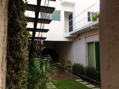 an external view of a building with a balcony at Posada San Cristobal in Cuernavaca