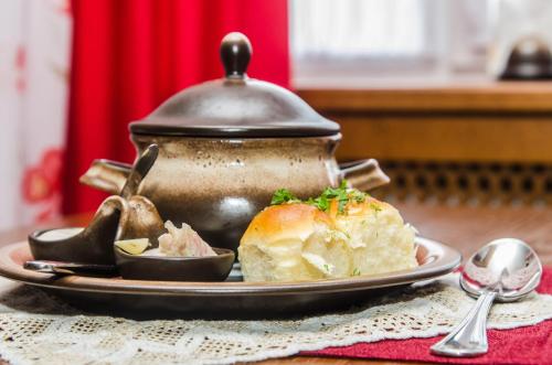 a tea pot and a plate of food on a table at Lepsza Садыба in Bila Tserkva