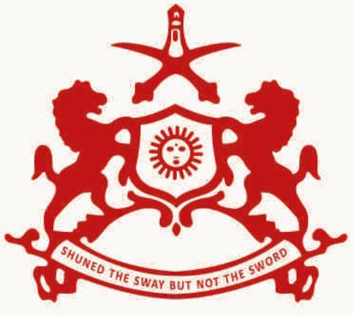 a red emblem with two horses and the words survived the sweep but not the sword at Hotel Pushkar Palace in Pushkar