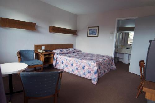 Postel nebo postele na pokoji v ubytování Daigle's Motel
