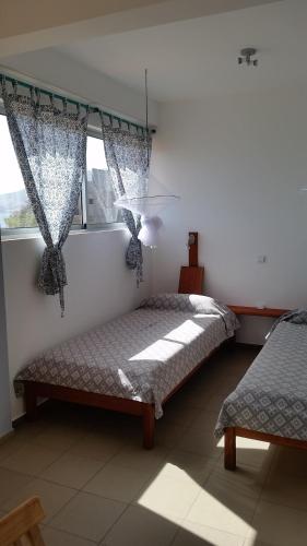 Postel nebo postele na pokoji v ubytování Casa Patio