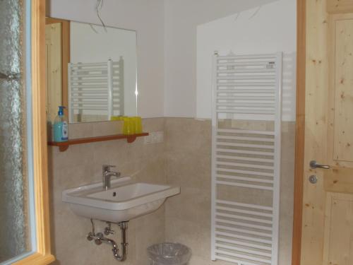 a bathroom with a sink and a mirror at Pichlerhof in Bressanone