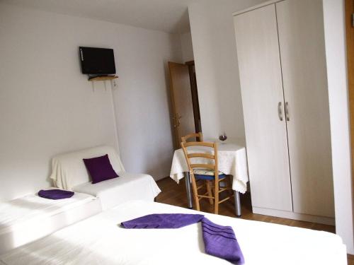 Postel nebo postele na pokoji v ubytování Guesthouse Marinovic