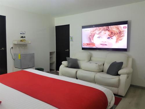 Televisyen dan/atau pusat hiburan di Hotel San Jeronimo Armenia
