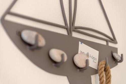 a close up of a clock with rocks on it at Anemologio in Finikas