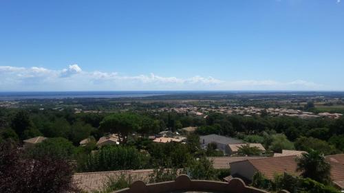 a view of a city from a roof at Appartements Luccisano in Borgo