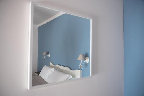 a room with a bed seen through a window at Anima Antiqua Relais & Spa in Gioia Sannitica