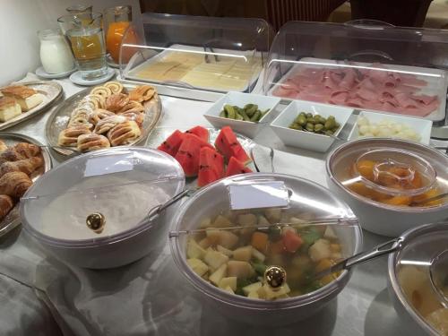 a table with many different types of food on it at Garni Franca b&b in Selva di Val Gardena