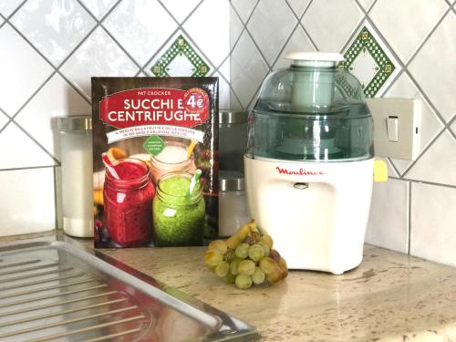 a food processor on a counter next to a box of food at La Casa Grande di Pantelleria in Pantelleria