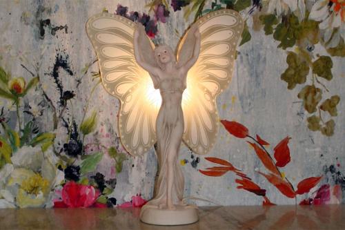 a statue of an angel with white wings at CarlstadCity H Boutique Hotell in Karlstad
