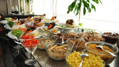 a buffet with many different types of food on a table at Petra Sella Hotel in Wadi Musa