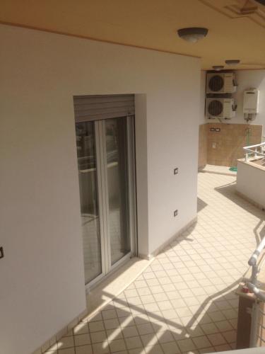 a view of a kitchen with a sliding glass door at fausthome in Assemini