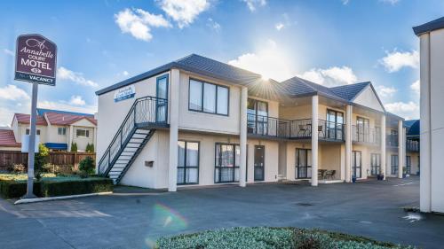 a building with a sign in front of it at Annabelle Court Motel in Christchurch