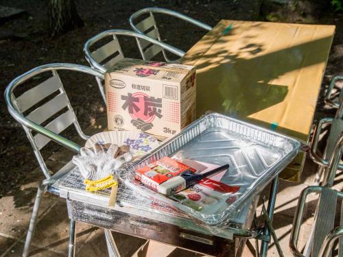 a box sitting on a chair with a box at Shurin in Tsumagoi