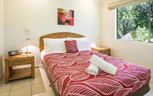 Ένα ή περισσότερα κρεβάτια σε δωμάτιο στο Melaleuca Resort