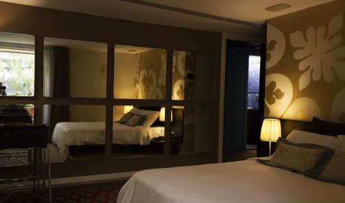 a bedroom with a large mirror and a bed at Avogaria 5 Rooms in Venice