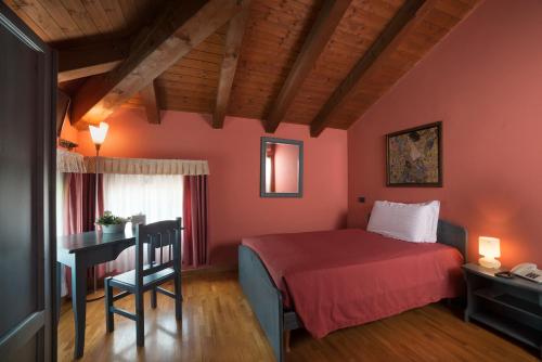Кровать или кровати в номере Country Hotel Al Gallo