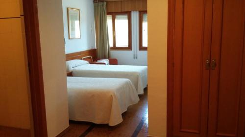 Postel nebo postele na pokoji v ubytování Hotel SNÖ La Corza Blanca