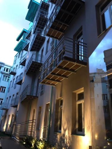a building with balconies on the side of it at Luxury apartment Spálená in Prague