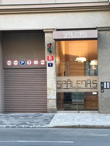a building with two garage doors and a traffic light at Luxury apartment Spálená in Prague