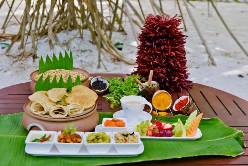 a tray of food on top of a table at Villa Nautica Paradise Island Resort in North Male Atoll