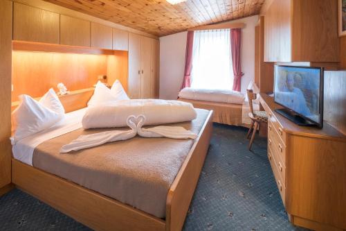 Postel nebo postele na pokoji v ubytování Hotel Serena