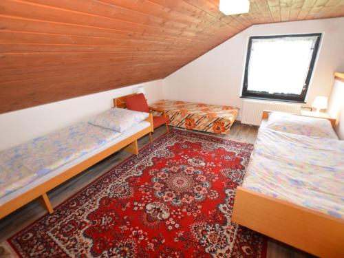 a room with two beds and a rug at Country House in Czech Forest with Pool in Konstantinovy Lázně