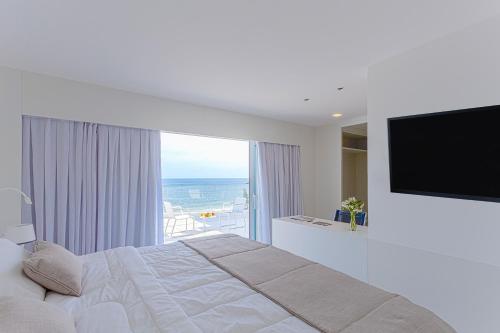 Ein Bett oder Betten in einem Zimmer der Unterkunft CDesign Hotel