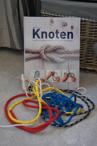 a pile of ropes on the floor next to a box at Apartment Nordenham in Nordenham