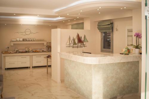 a large kitchen with a large island in the middle at KalyBay in Kalives Poligirou